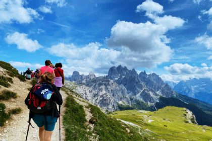 Group of hikers hiking mountain trail