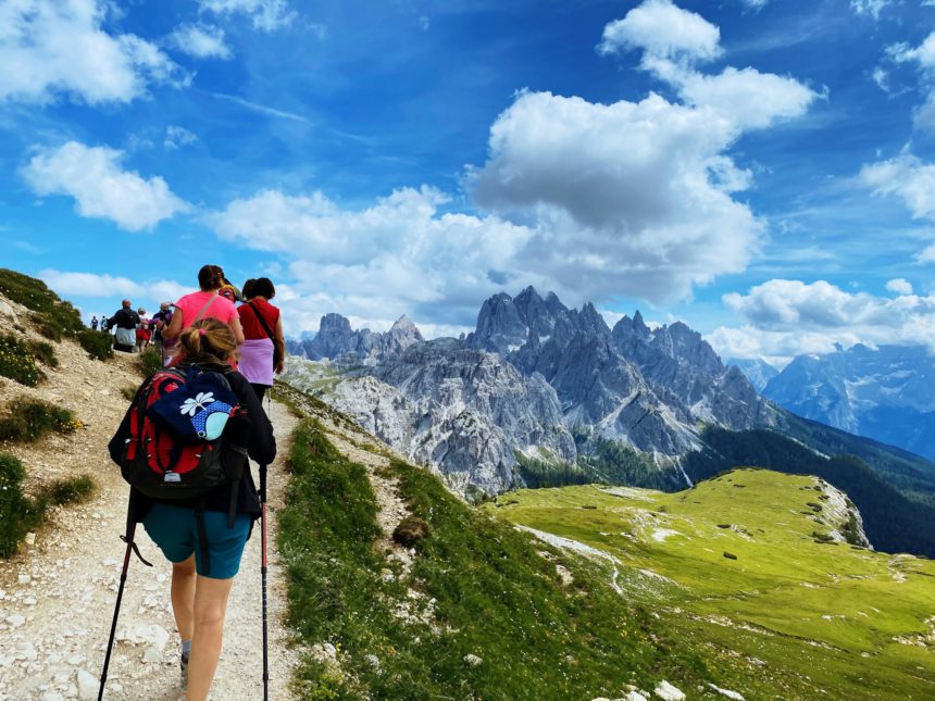 Group of hikers hiking mountain trail