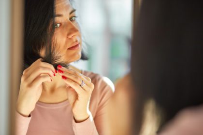 Problem damaged hair concept, Pretty Brunette woman brushing hair with comb